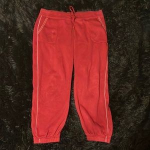 Red sweats with white stitch line and cuffed ankles